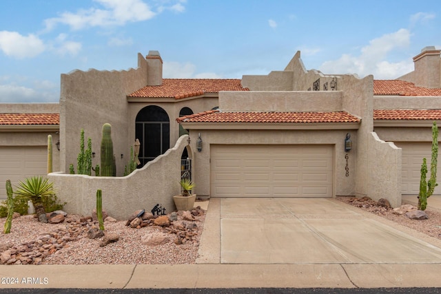 view of front of home with a garage