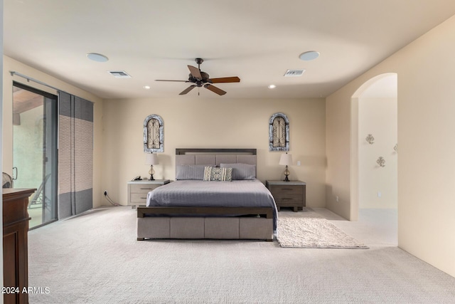 carpeted bedroom with ceiling fan and access to outside