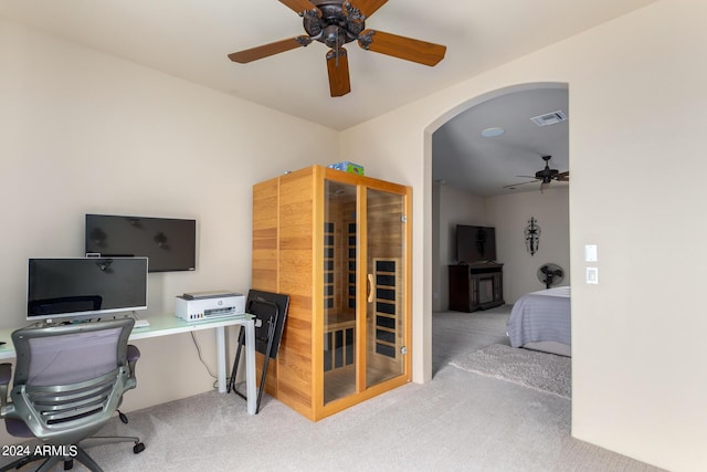 home office featuring ceiling fan and carpet