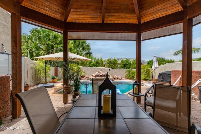 view of patio / terrace with a gazebo and a fenced in pool