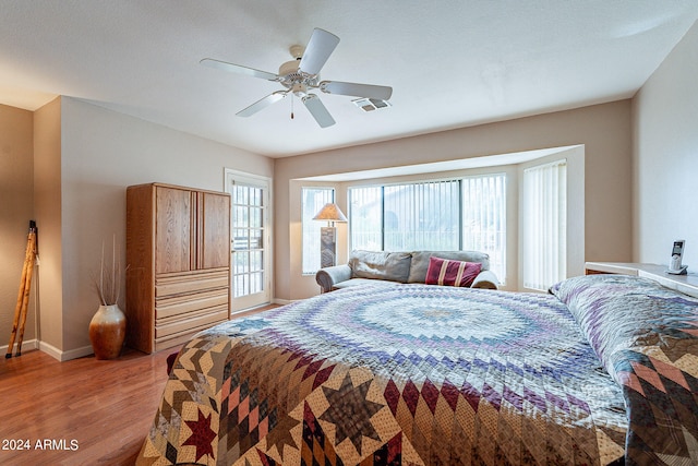 bedroom featuring ceiling fan and hardwood / wood-style flooring