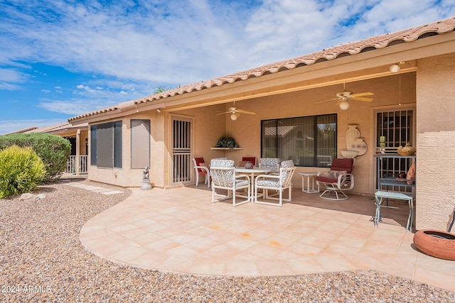 exterior space featuring ceiling fan