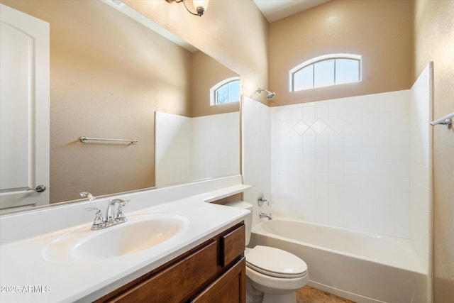 bathroom with vanity, shower / bathing tub combination, and toilet