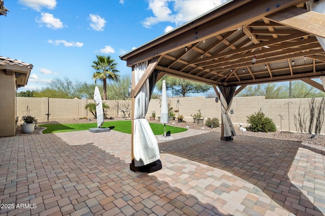 view of patio featuring a gazebo and a fenced backyard