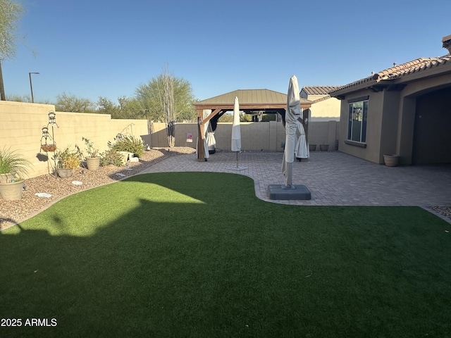 view of yard featuring a fenced backyard and a patio