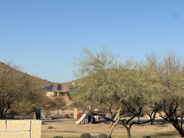 view of property's community featuring playground community