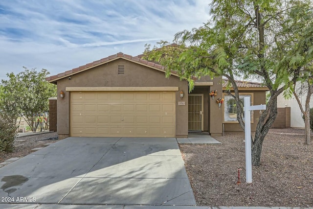 25763 W Satellite Ln, Buckeye, AZ 85326 - ranch-style house with stucco siding, a tile roof, driveway, and an attached garage