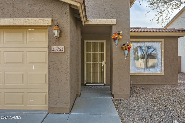 property entrance featuring a garage