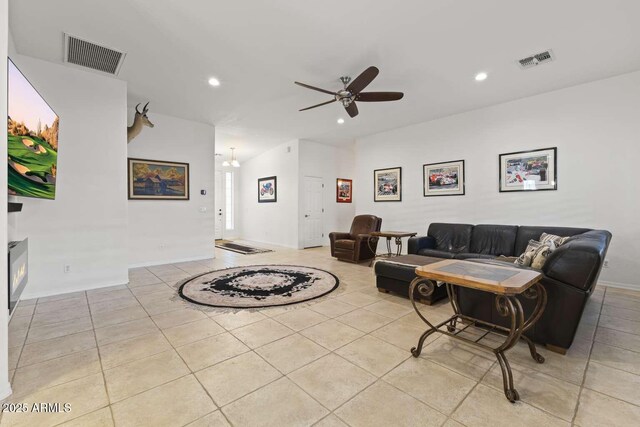 living area featuring tile patterned floors, ceiling fan, visible vents, and recessed lighting