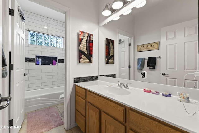 full bathroom featuring tile patterned flooring, toilet, vanity, and shower / bathtub combination