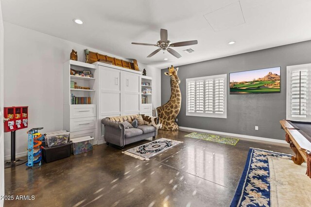 sitting room featuring a ceiling fan, visible vents, recessed lighting, attic access, and baseboards