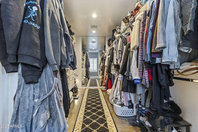 walk in closet with visible vents