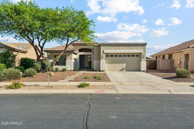8758 W Myrtle Ave, Glendale, AZ 85305 - view of front of house with a garage, concrete driveway, and stucco siding
