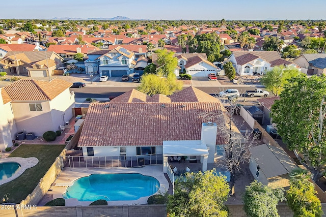 aerial view of residential area with a pool area