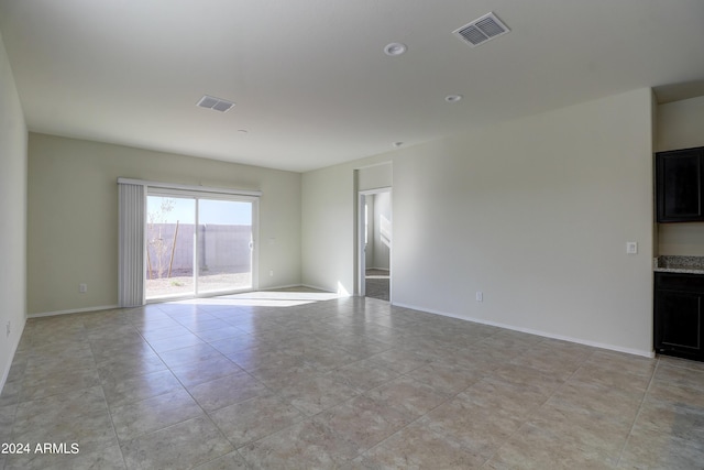 unfurnished room with light tile patterned floors