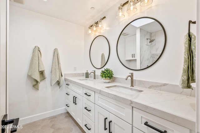 bathroom with vanity, walk in shower, and tile patterned flooring