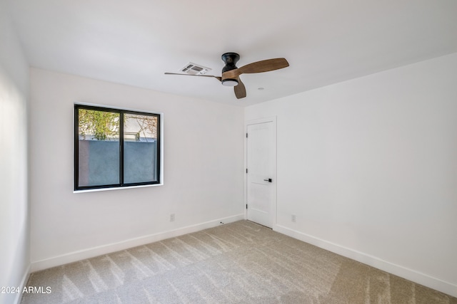 unfurnished room with carpet floors and ceiling fan