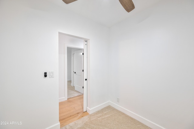 unfurnished room featuring hardwood / wood-style floors and ceiling fan