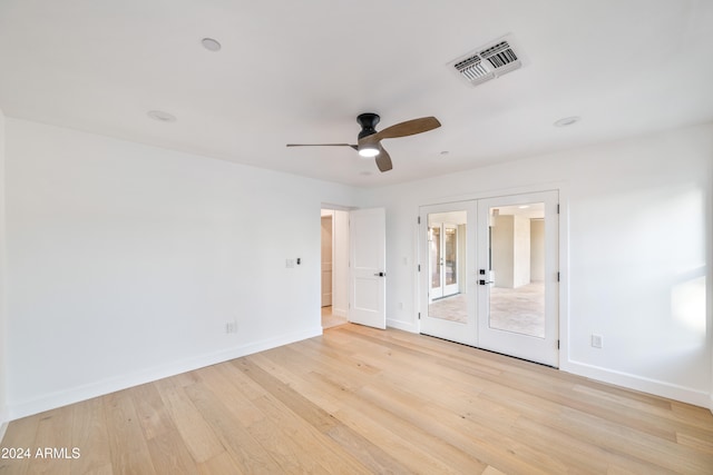 unfurnished room with light hardwood / wood-style floors, french doors, and ceiling fan