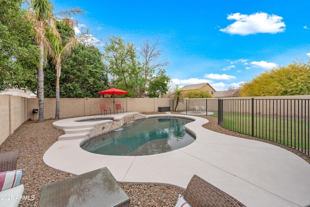 view of swimming pool with a patio and an in ground hot tub