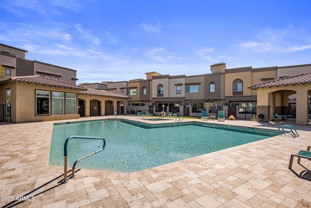 view of swimming pool with a patio