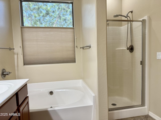 4117 W Allen St, Laveen, AZ 85339 - bathroom featuring a shower stall, a garden tub, and vanity