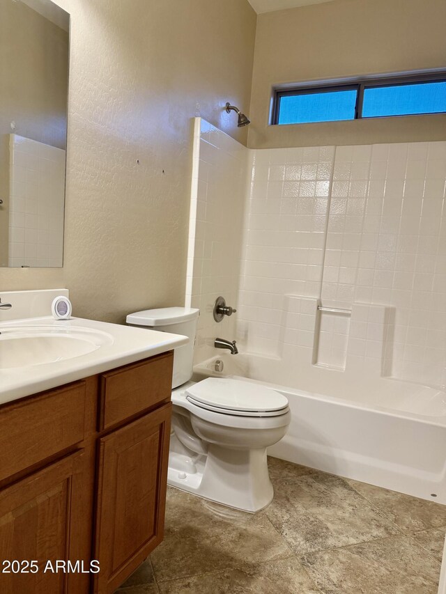 4117 W Allen St, Laveen, AZ 85339 - bathroom with toilet, vanity, washtub / shower combination, and a textured wall