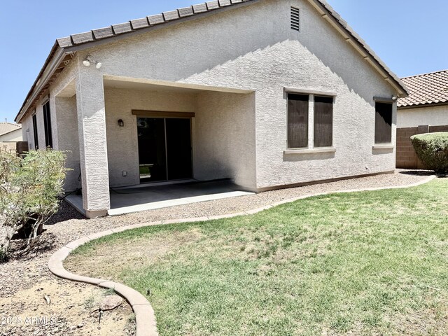 4117 W Allen St, Laveen, AZ 85339 - rear view of house featuring stucco siding and a patio area