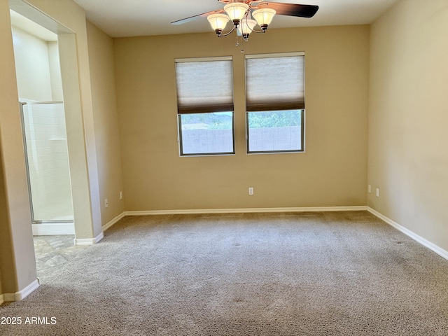 4117 W Allen St, Laveen, AZ 85339 - spare room with ceiling fan, carpet floors, and baseboards