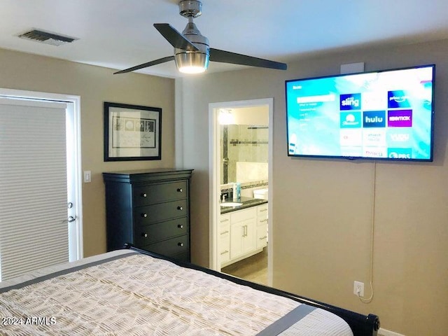 bedroom featuring ceiling fan and ensuite bath