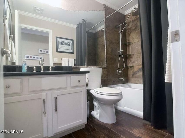 full bathroom featuring crown molding, shower / bath combination with curtain, toilet, vanity, and hardwood / wood-style flooring