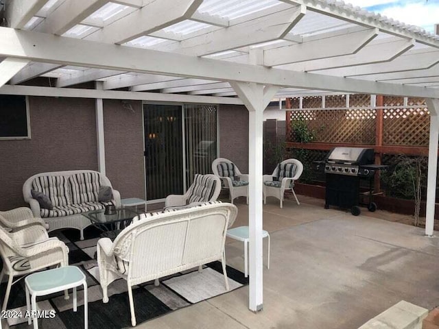 view of patio with a pergola, grilling area, and an outdoor hangout area