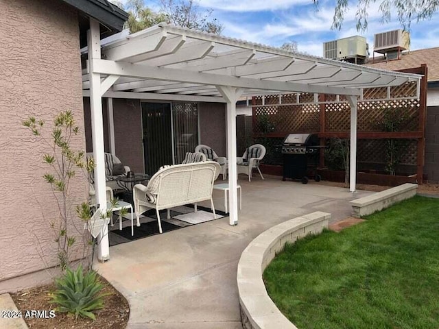 view of patio with a pergola and a grill