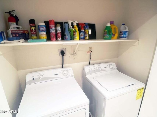 washroom featuring washing machine and dryer