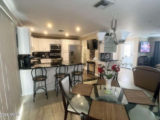 tiled dining room with ornamental molding