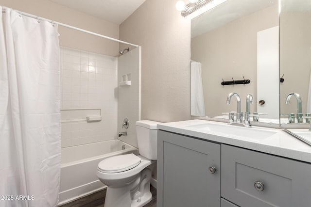 full bath with shower / bath combination with curtain, wood finished floors, vanity, and toilet