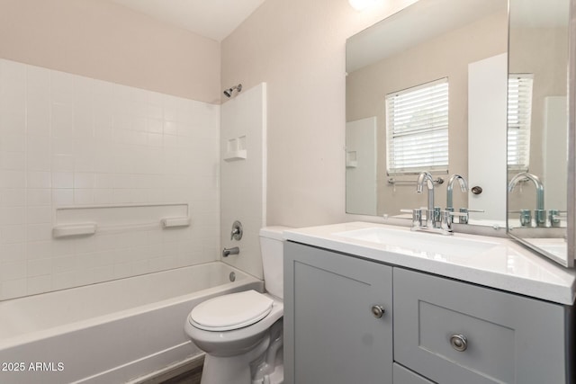 full bathroom featuring  shower combination, vanity, and toilet