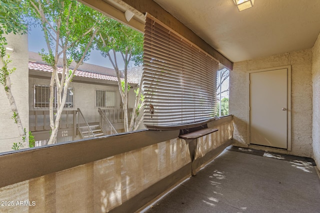 view of patio featuring a balcony