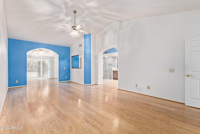 unfurnished living room with light hardwood / wood-style floors, vaulted ceiling, and ceiling fan