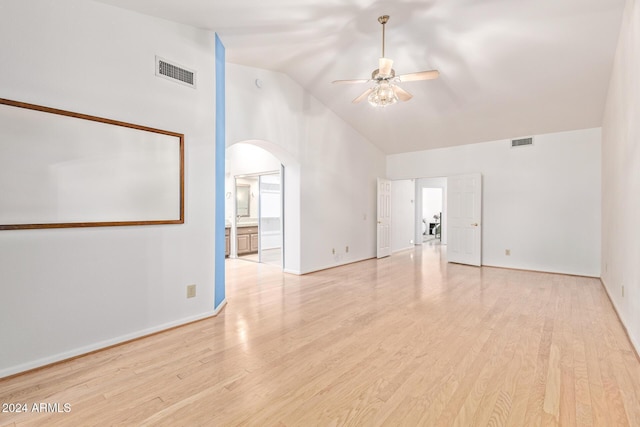 empty room featuring ceiling fan, light hardwood / wood-style flooring, and high vaulted ceiling