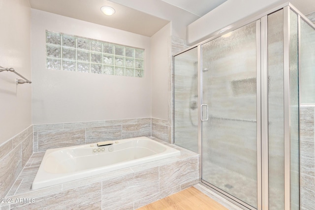 bathroom with hardwood / wood-style floors and plus walk in shower