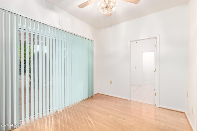 unfurnished room featuring ceiling fan and light hardwood / wood-style flooring