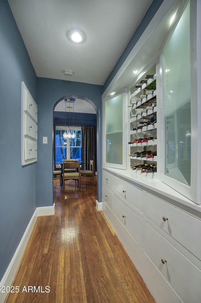 hallway featuring dark hardwood / wood-style flooring