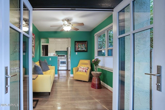 interior space featuring ceiling fan and wood-type flooring