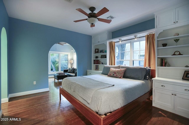 bedroom with ceiling fan and dark hardwood / wood-style flooring