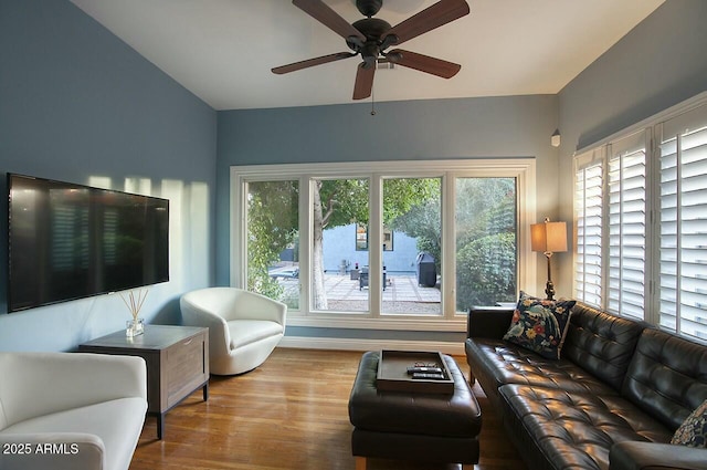 living room with ceiling fan and light hardwood / wood-style floors