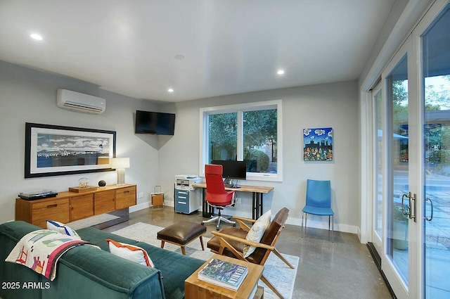 living room with a wall unit AC, concrete floors, and french doors