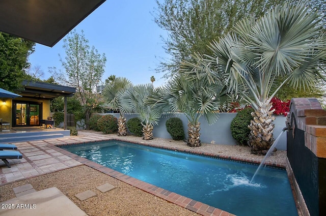 view of swimming pool with a patio