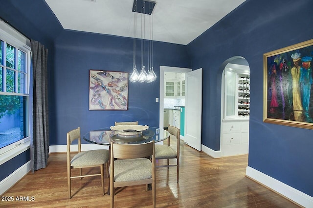 dining space featuring hardwood / wood-style flooring