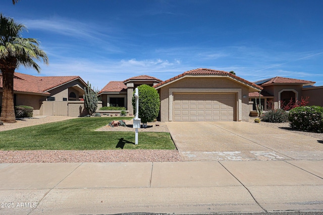 mediterranean / spanish-style home with a garage, a front yard, stucco siding, a tiled roof, and driveway